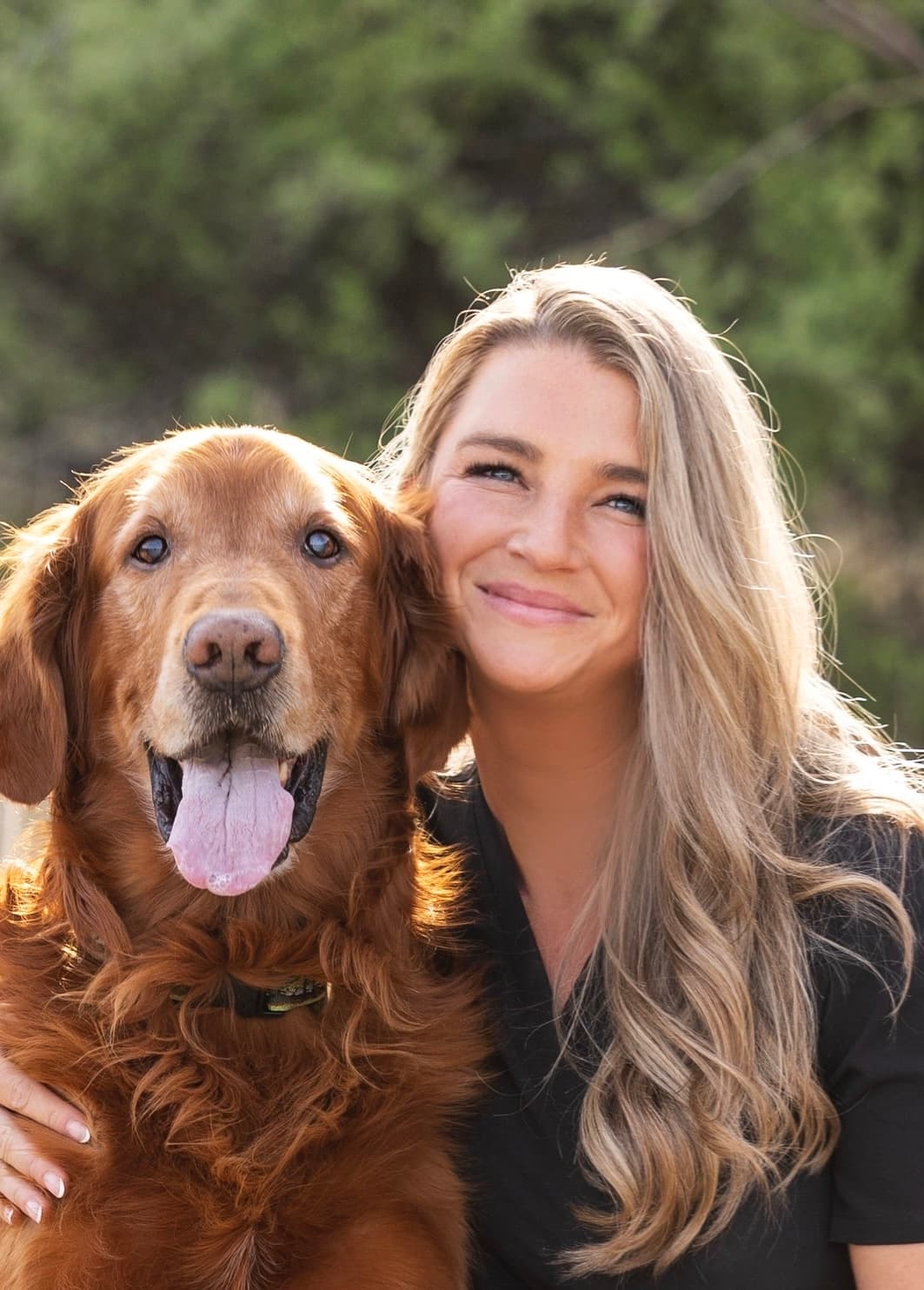 Katlyn, founder of Vetruly, with her golden retriever